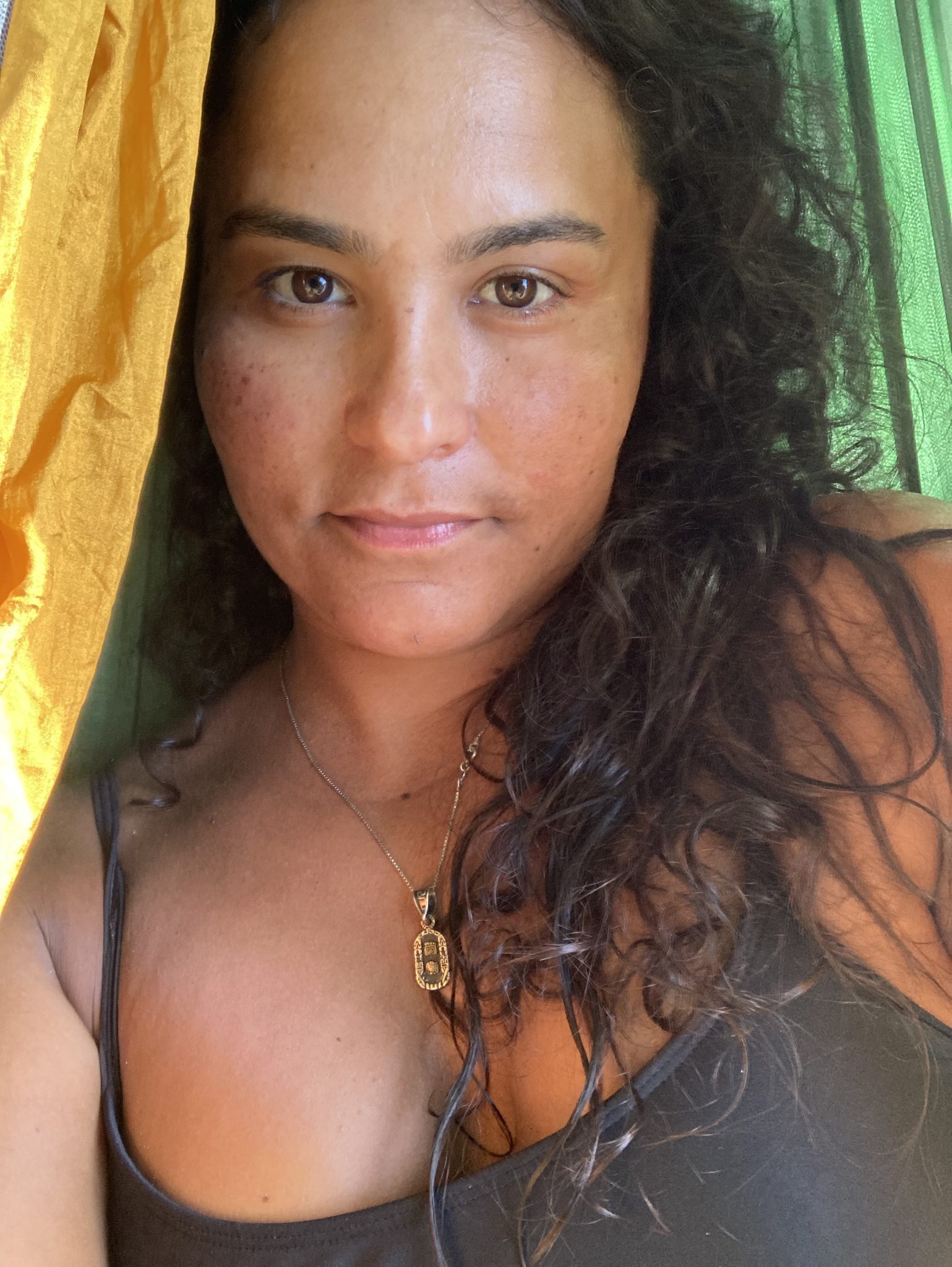 Stephanie Bastos take a selfie; she/her from Miami, FL originally Tequesta land, daughter of Brazilian immigrant parents