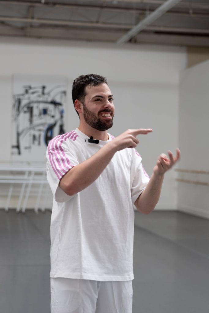 Brian Golden addresses dancers in rehearsal.